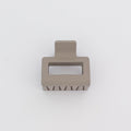 Beige hair clip on a white background
