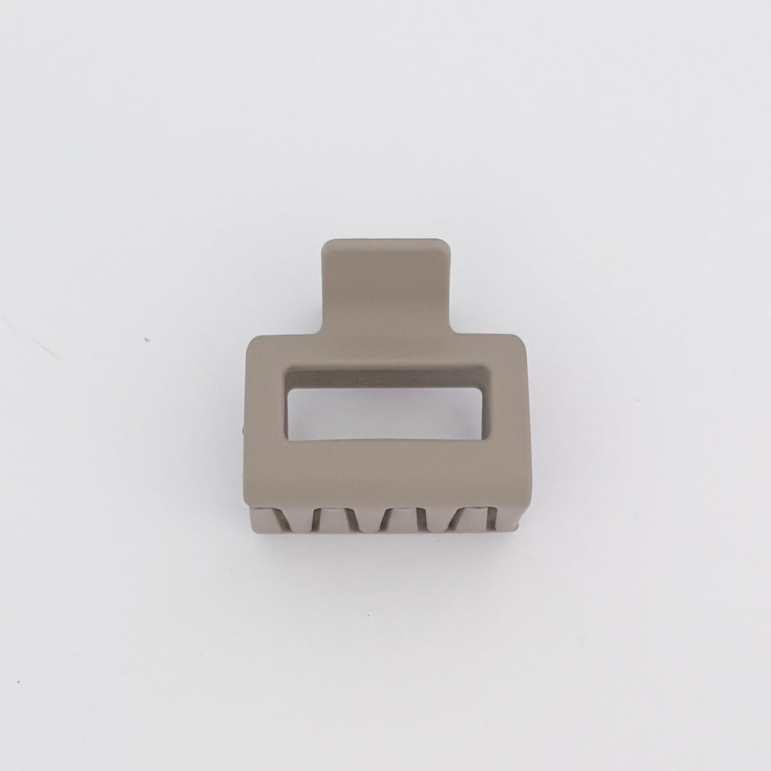 Beige hair clip on a white background
