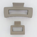 Two beige rectangular objects on a white background