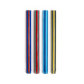 Two sets of colorful striped candles on a white background