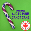 Handmade sugar plum candy cane with purple and white stripes on a green background, featuring Volio's Confections branding.
