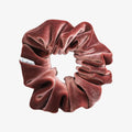 Red velvet scrunchie on a white background
