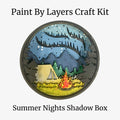 Paint by Layers Craft Kit for 'Summer Nights Shadow Box' with a scenic design of a tent and campfire.