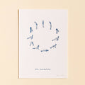Framed artwork with blue line drawings of yoga poses on a white background