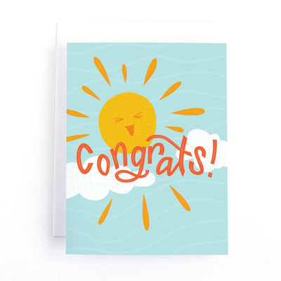 A congratulations card featuring a smiling sun with rays shining on clouds. The text 