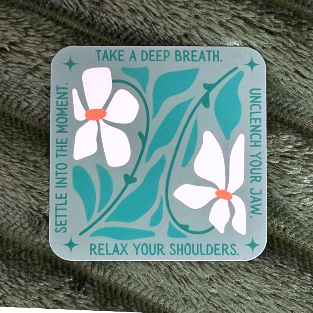 Decorative card with floral design and relaxation instructions on a textured surface