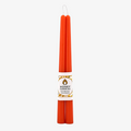 Two orange beeswax candles are standing upright, tied together with a string. The candles have a label that says "HONEY CANDLES Pure Beeswax."