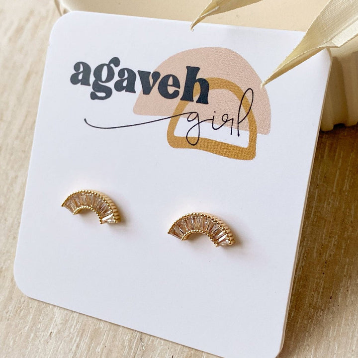 A pair of gold-plated stud earrings with a semicircle design. The earrings are adorned with multiple small cubic zirconia stones arranged in a fan shape.
