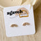 A pair of gold-plated stud earrings with a semicircle design. The earrings are adorned with multiple small cubic zirconia stones arranged in a fan shape.