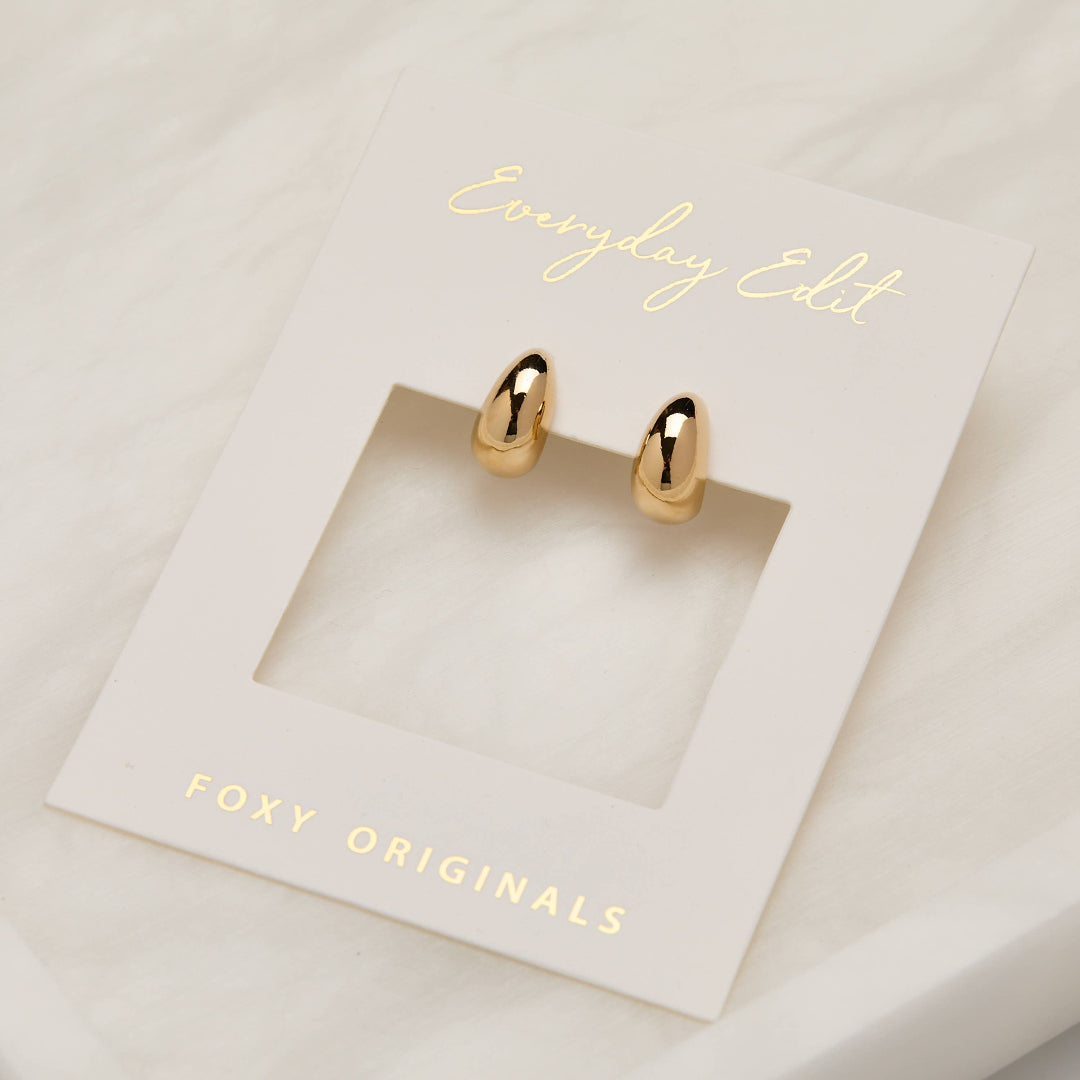 Gold earrings on a 'Foxy Originals' card with 'Everyday Edit' text.