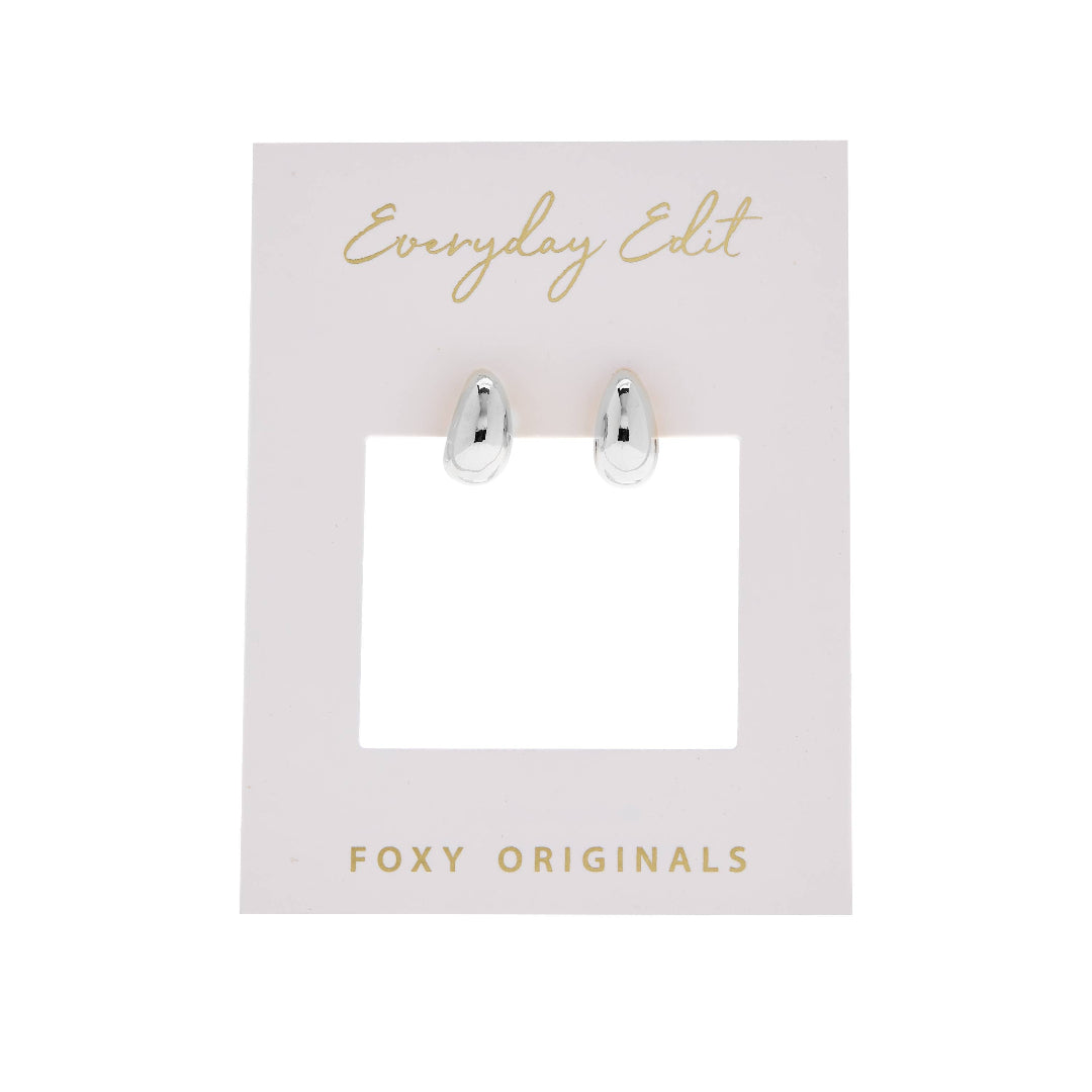 Silver earrings on a 'Everyday Edit' card with 'Foxy Originals' branding.