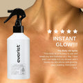 A white bottle with a black label and a spray nozzle. The label reads "Everist" and lists the product's benefits, including instant absorption, no greasy feel, collagen boosting, and being natural and biodegradable. The bottle is surrounded by oranges and orange peels. Text describing the product's features and benefits is also visible, including its shower-safe and recyclable aluminum bottle, and its waterless, vegan, and cruelty-free nature.