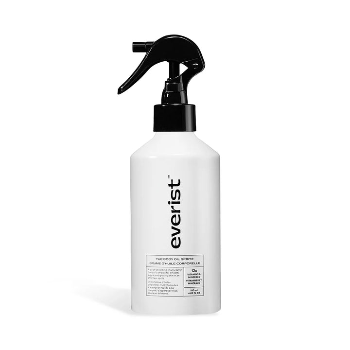 A white bottle with a black label and a spray nozzle. The label reads 