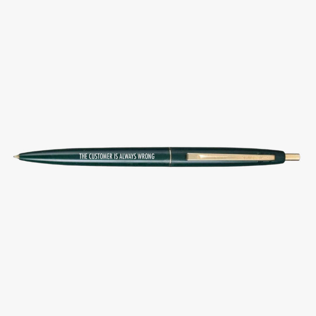 Green pen with 'The Customer is Always Wrong' text on a white background