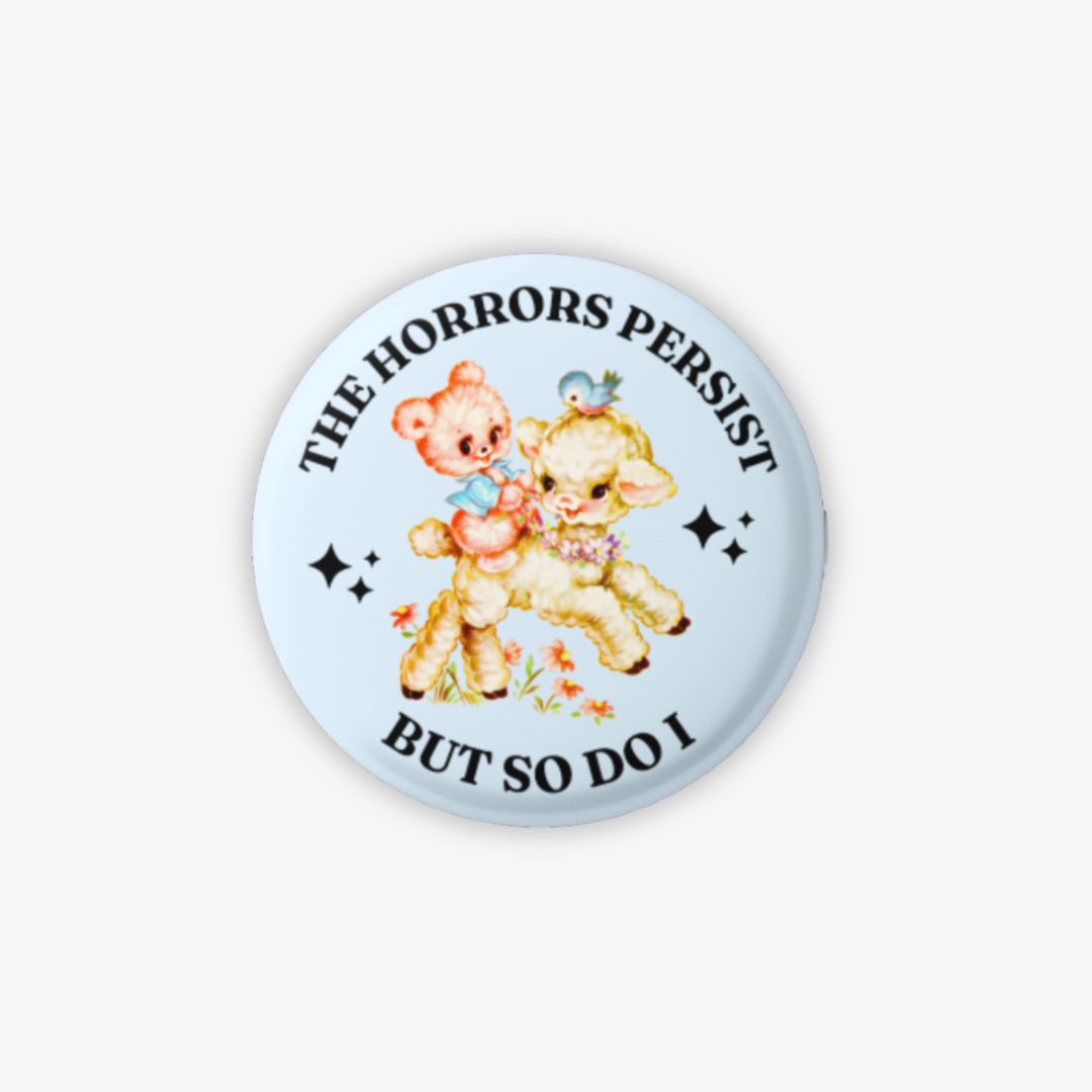 Button badge with cartoon bears and text on a light blue background