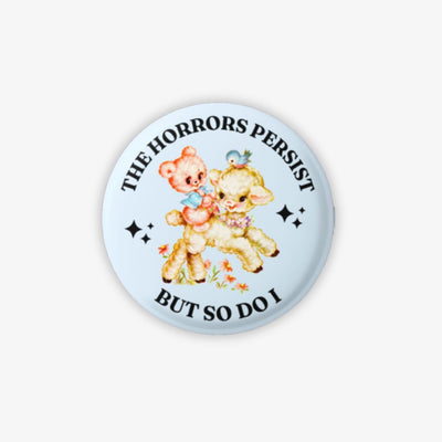Button badge with cartoon bears and text on a light blue background