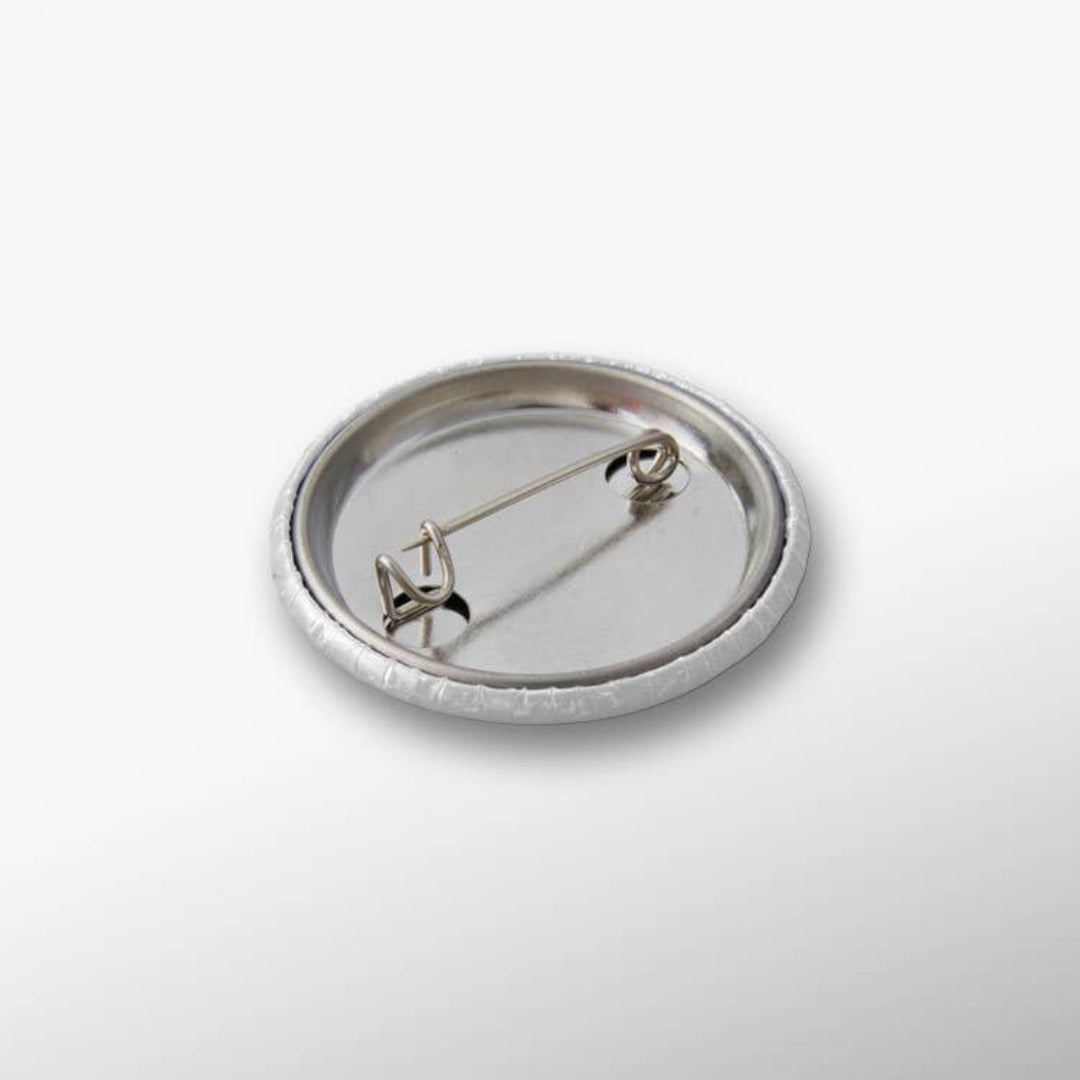 Silver brooch on a white background