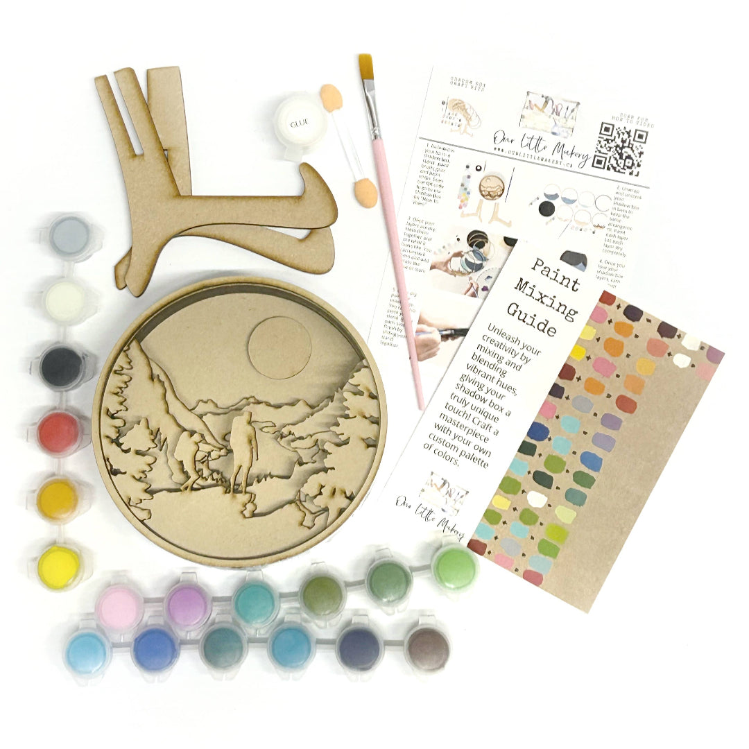 Artistic painting kit with wooden circle, paintbrushes, color swatches, and instructions on a white background.