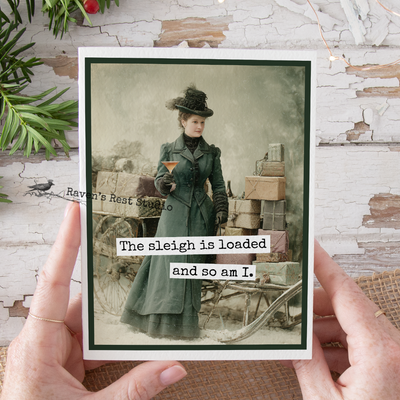 Person holding a framed vintage-style photo of a woman in a green coat with text overlay.