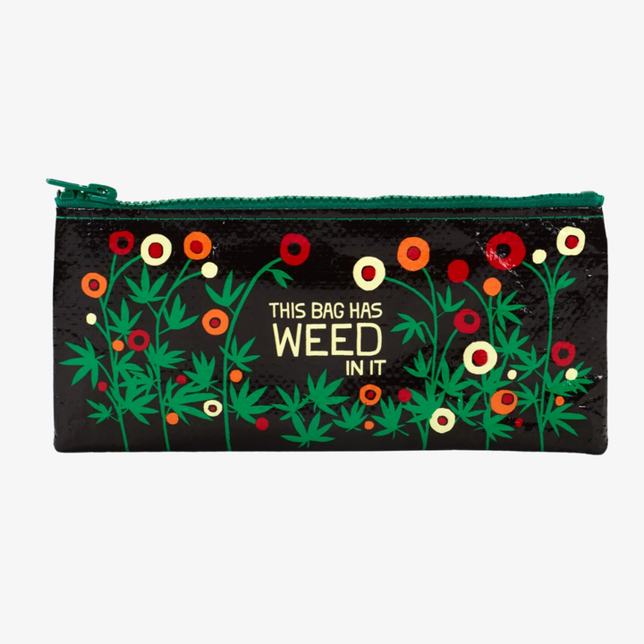 A black zippered pouch with a playful design. The pouch has a dark background with colorful flowers and marijuana leaves, and the text 
