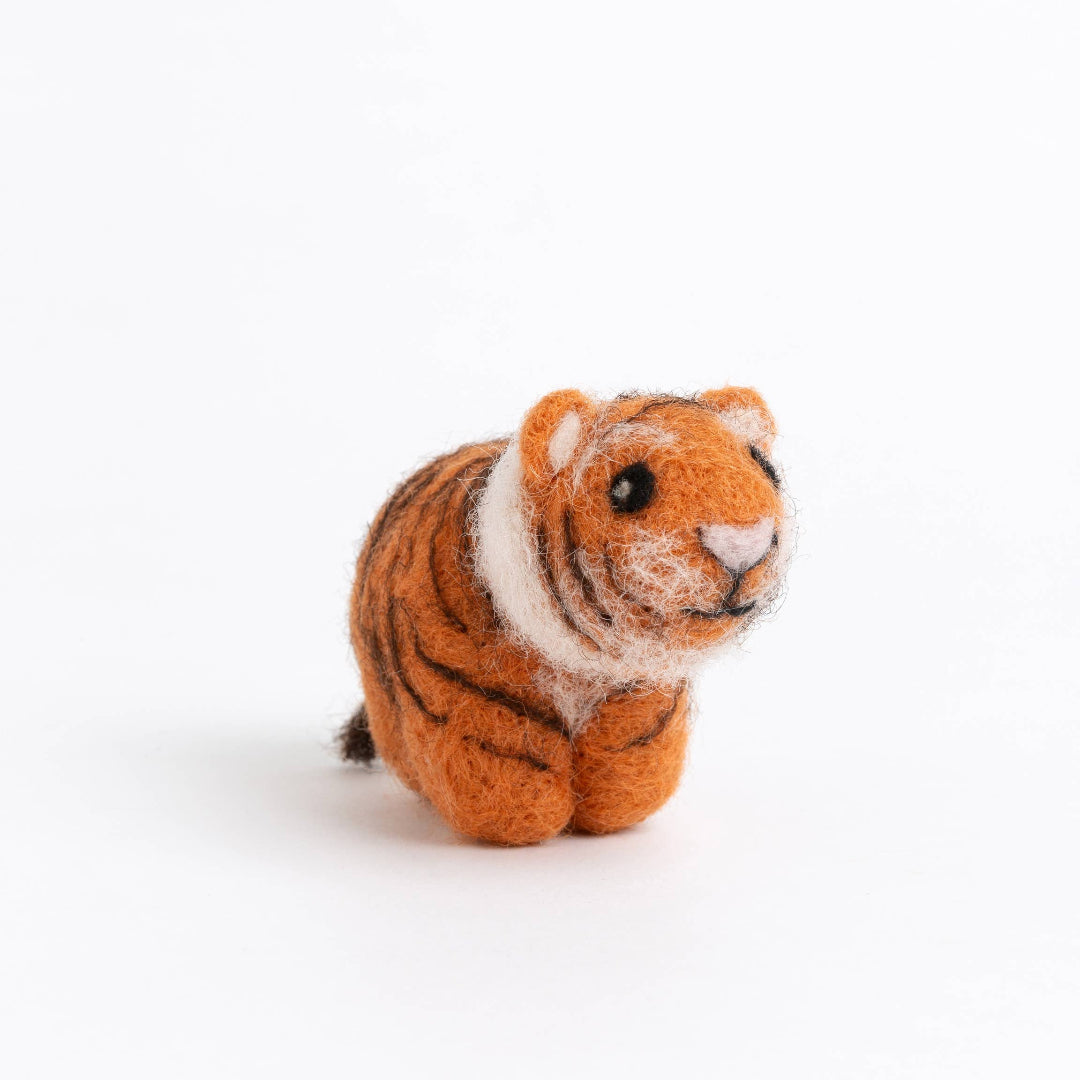 Small tiger figurine on a white background