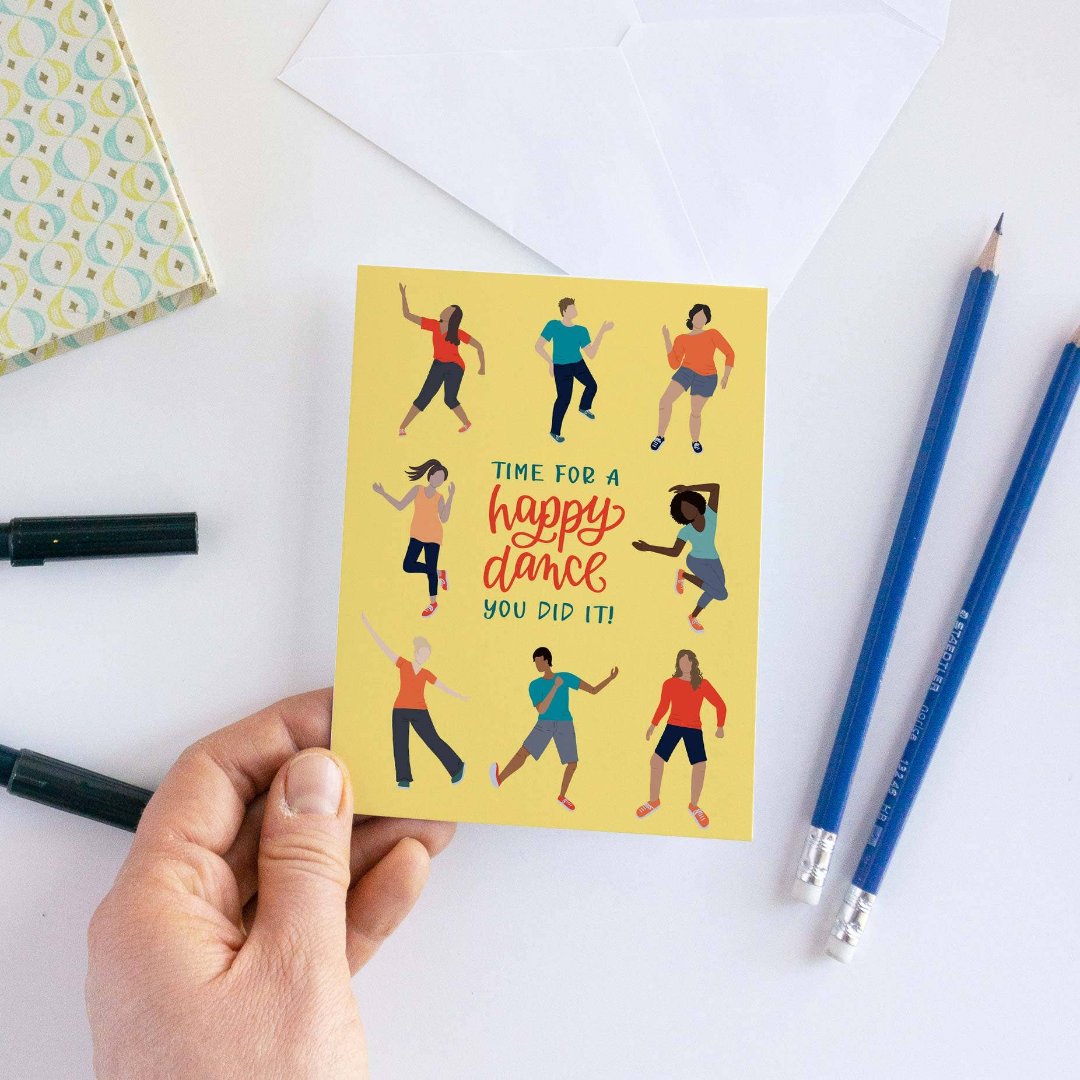 A card with a yellow background featuring seven people of different ages and races dancing. The text "TIME FOR A HAPPY DANCE YOU DID IT!" is written in bold letters below the figures.