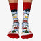 A pair of colorful socks with a winter scene. The socks feature houses, trees, and snowmen on a snowy landscape.