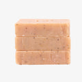 Three stacked bars of soap on a white background