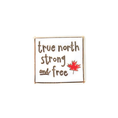 Pin with 'true north strong and free' text and a red maple leaf on a white background