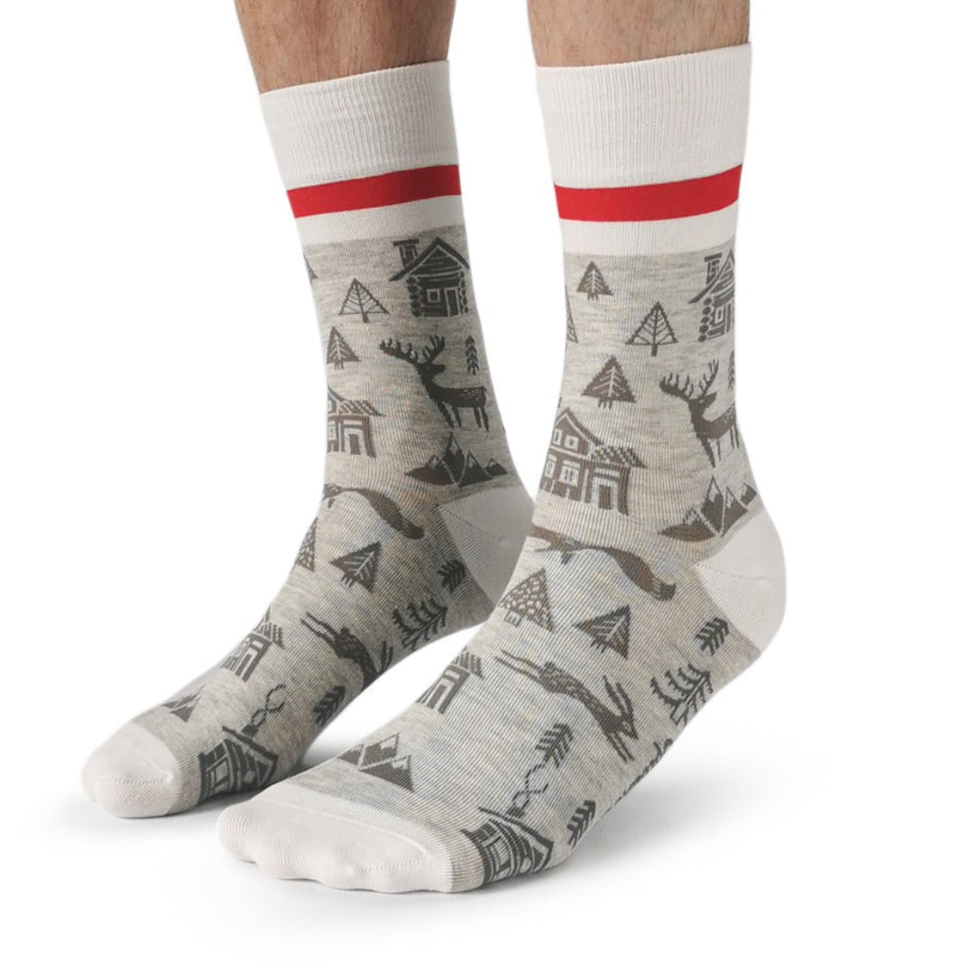Gray socks with nature-themed design and red stripes on a white background