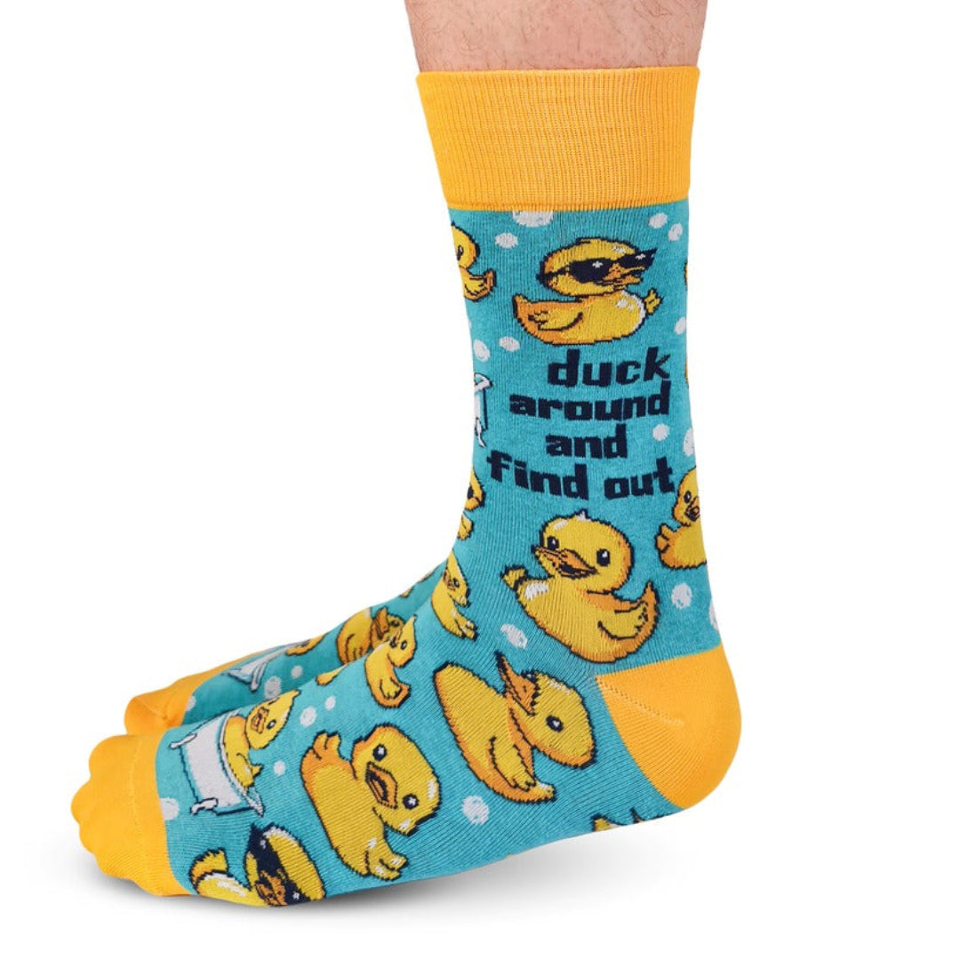 Sock with rubber duck pattern and text on a white background
