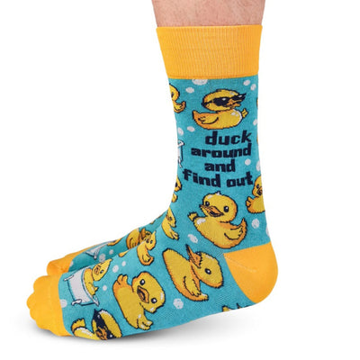Sock with rubber duck pattern and text on a white background