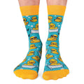 Blue socks with yellow rubber duck pattern on a white background