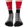 Red and black socks with white text and patterns on a white background