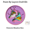 Unicorn shadow box craft kit with 'Paint By Layers' text on a white background