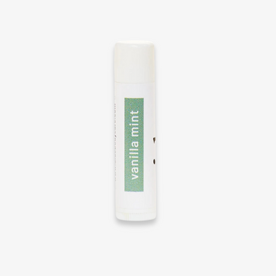 A white tube of lip balm with the word 