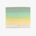 Gradient bar of soap with 'Soap Co' branding on a black background