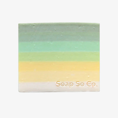 Gradient bar of soap with 'Soap Co' branding on a black background