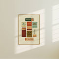 Framed artwork with various matchbox designs on a white wall