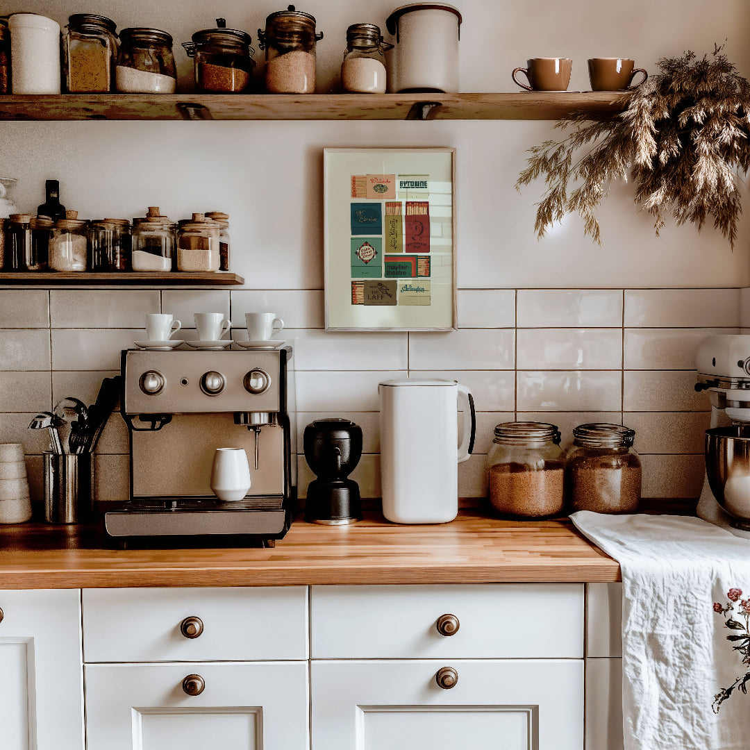 Kitchen counter with coffee machine, jars, and a mixer against a tiled wall.