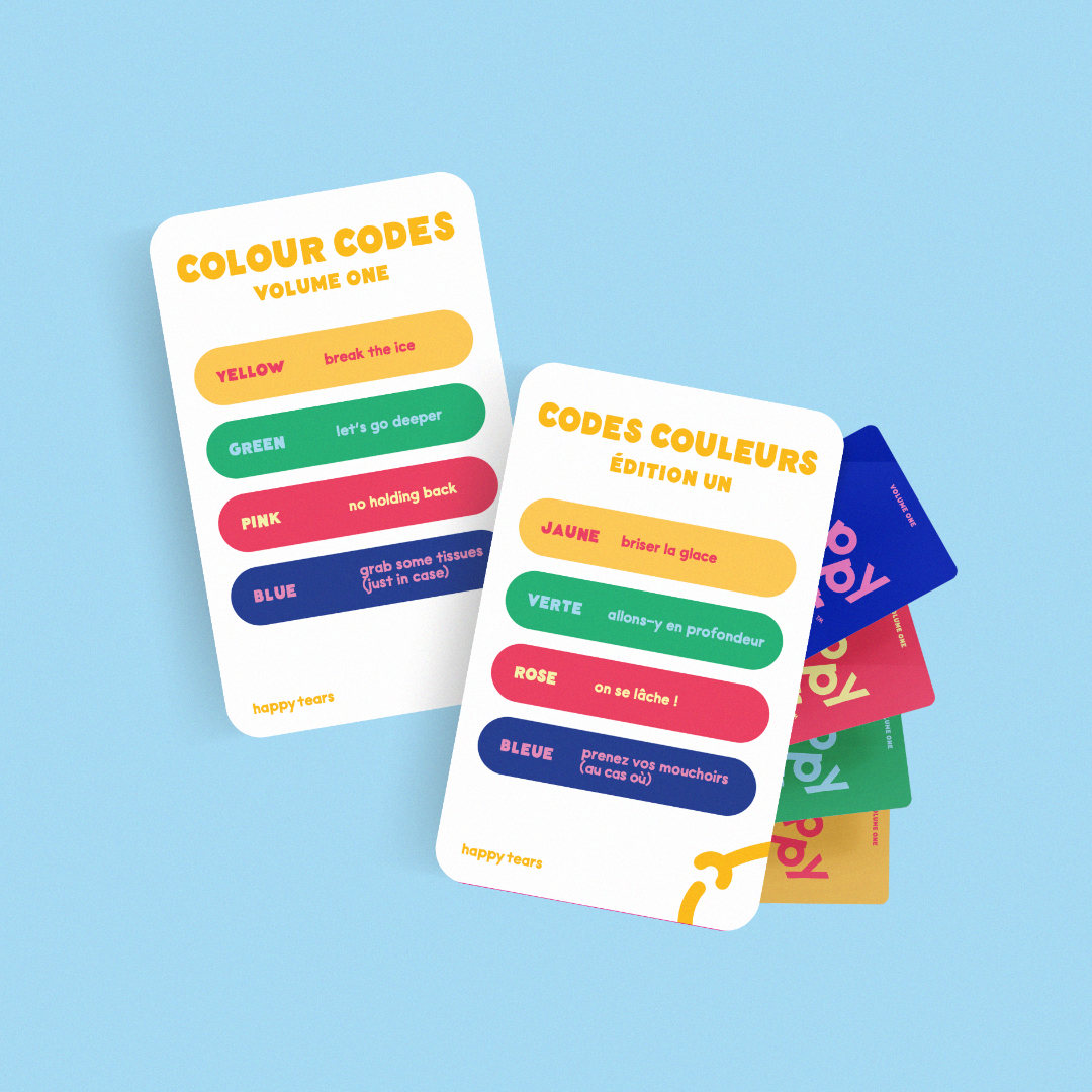 Happy Tears conversation cards, Ottawa. Inclusive card game for meaningful connections. Grey drawstring bag, multicoloured rainbow cards. Fun queer card game.