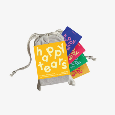 Happy Tears conversation cards, Ottawa. Inclusive card game for meaningful connections. Grey drawstring bag, multicoloured rainbow cards. Fun queer card game.