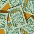 Wedding cards with 'Hooray! You're Married!' text and decorative elements on a patterned background.