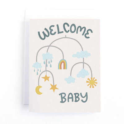 A welcome baby card featuring a mobile with clouds, a rainbow, stars, a moon, and raindrops. The words 