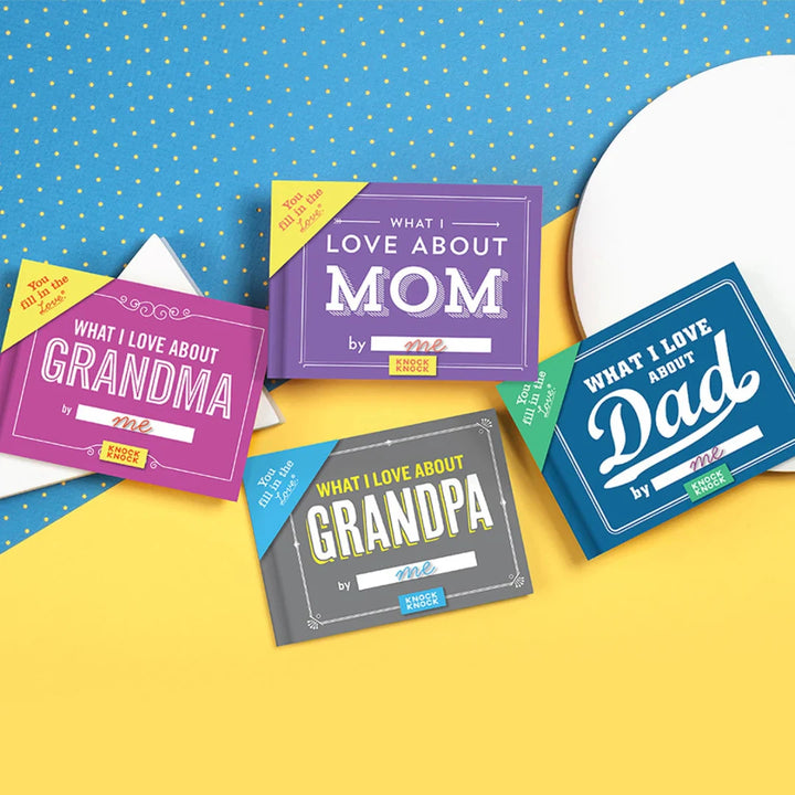 Four small, colorful books arranged on a blue and yellow background. The books are titled 