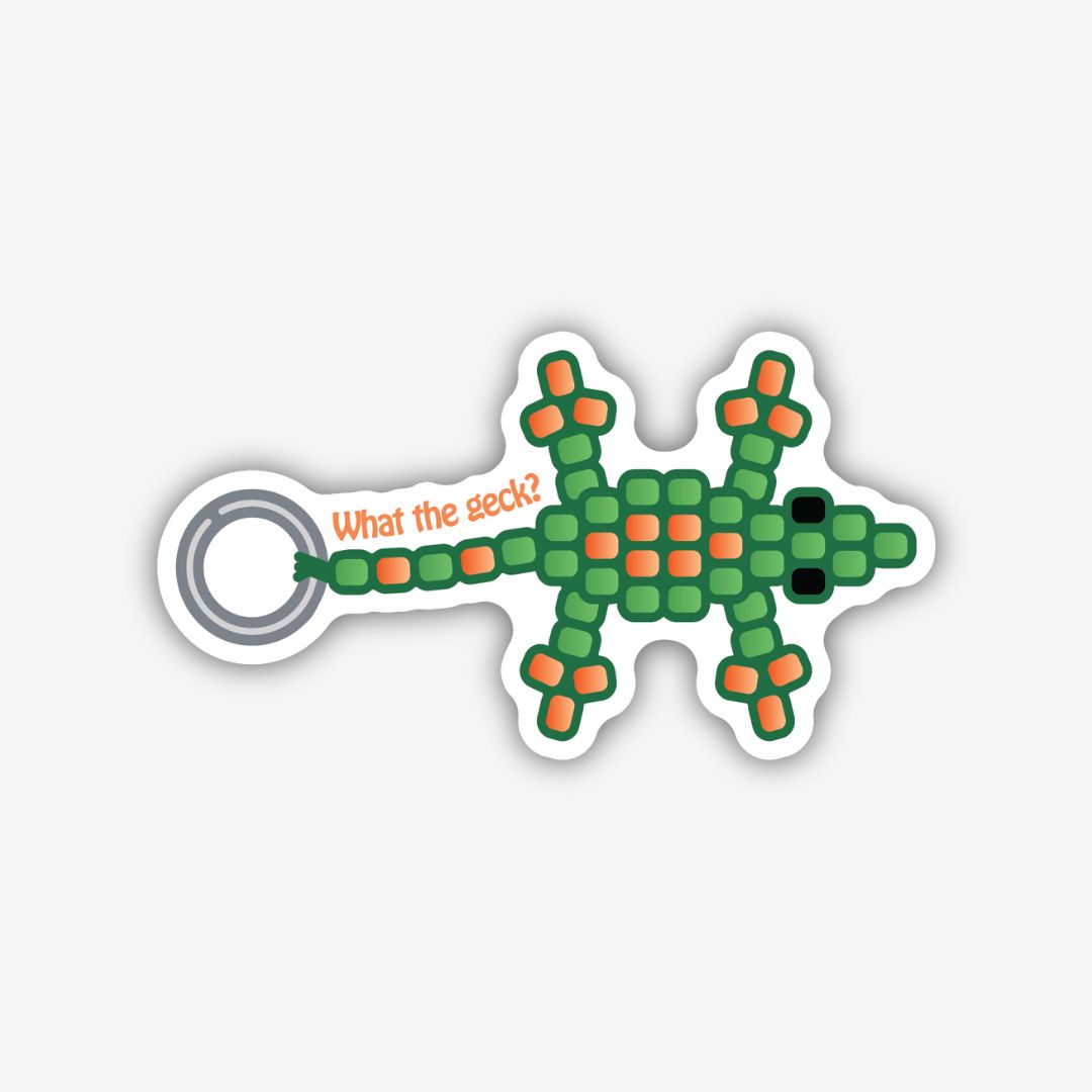 A playful sticker shaped like a green and orange beaded lizard. It has a ring at its tail end with the text "What the geck?" written in orange on a curved line. The entire sticker is outlined in black.