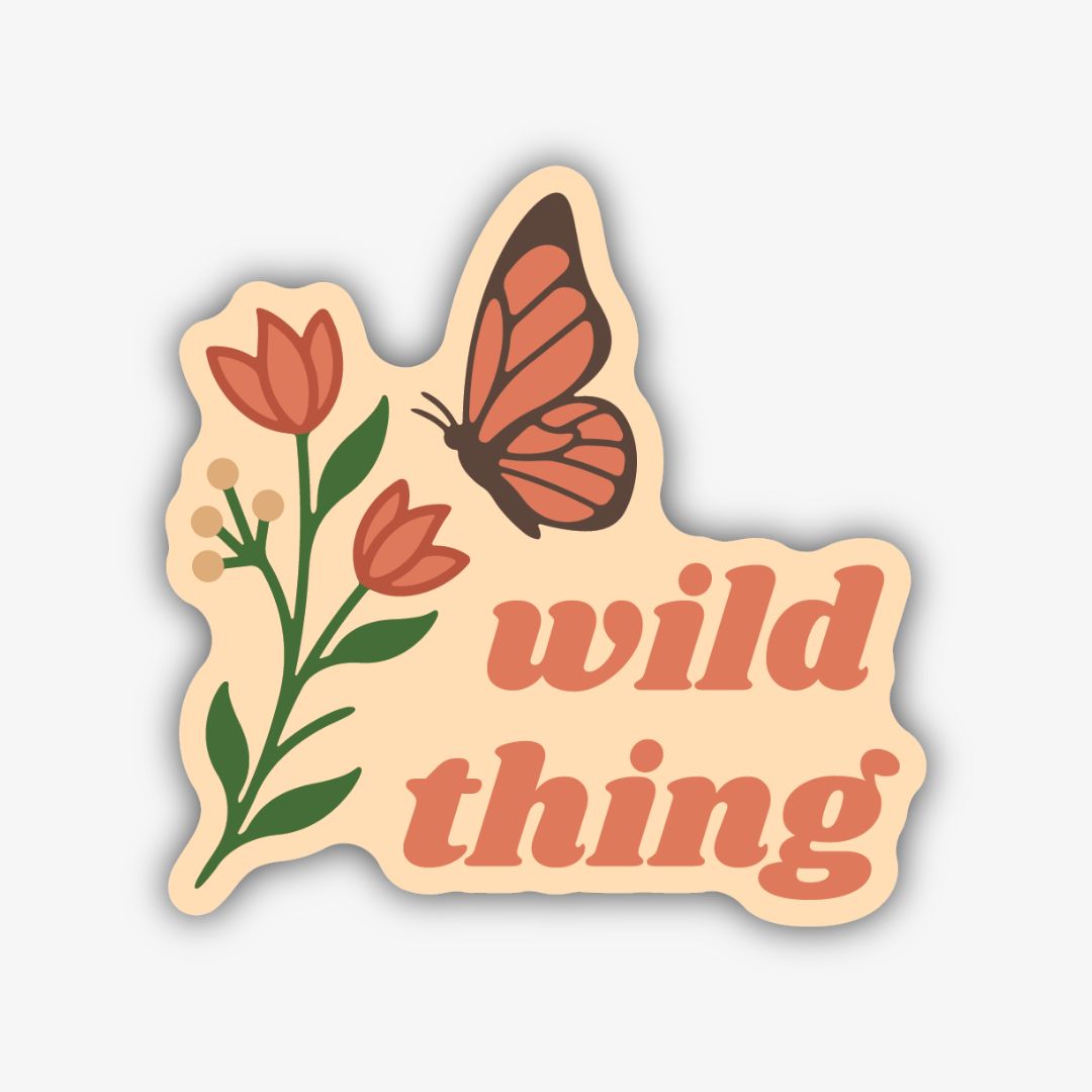 A whimsical sticker with a wavy light cream background and a thick black outline. It features a stylized plant with green stems, red-orange tulip-like flowers, and small beige berries on the left. On the right, a butterfly with red-orange wings and a brown body flies above the stacked text "wild thing" in a matching red-orange font.