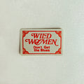 Rectangular sign with 'Wild Women Don't Get the Blues' text on a textured white background