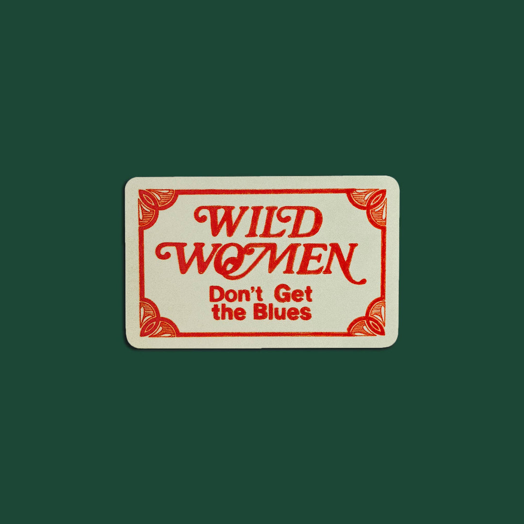 Rectangular sign with 'Wild Women Don't Get the Blues' text on a green background