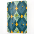 Notebook with a geometric pattern and floral design on a white background